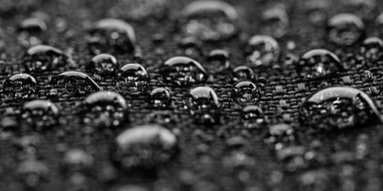 Waterproof textile after rain – covered with water drops